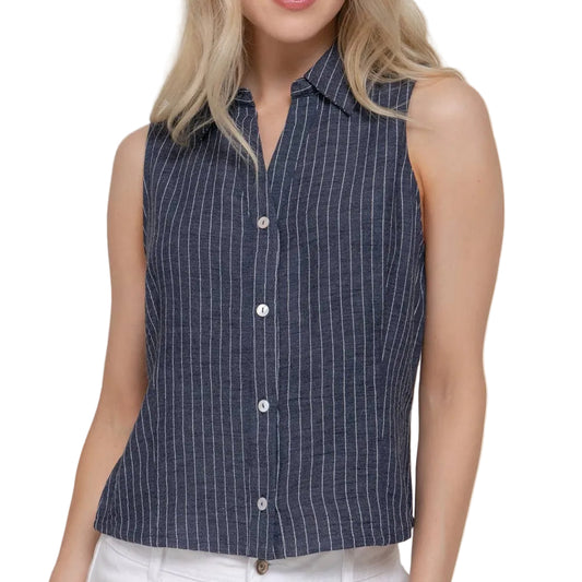 Woman wearing a sleeveless striped shirt against a plain background