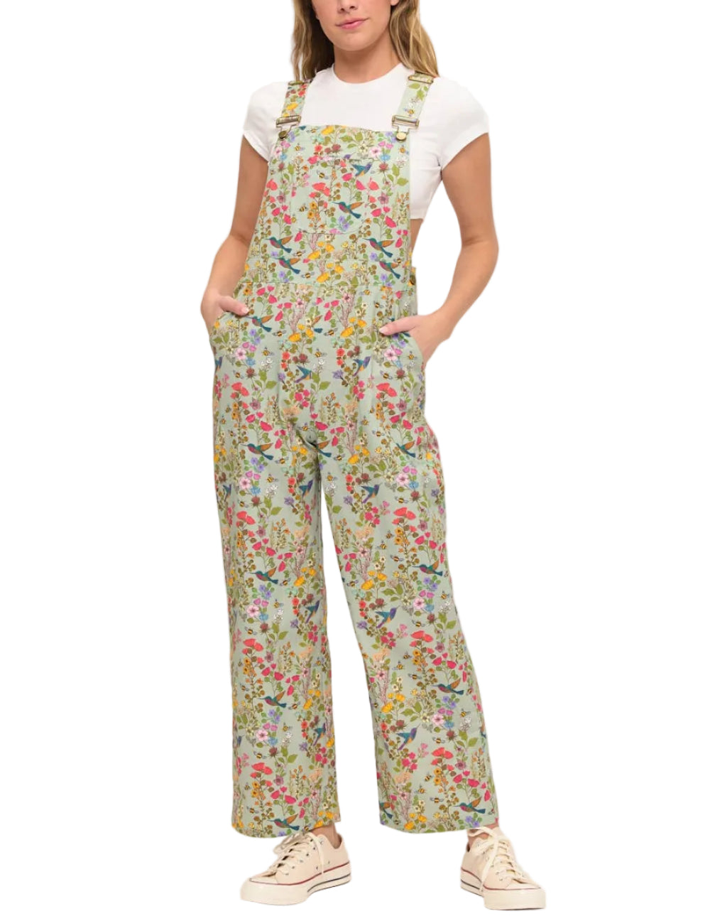 Woman wearing floral overalls on a white background