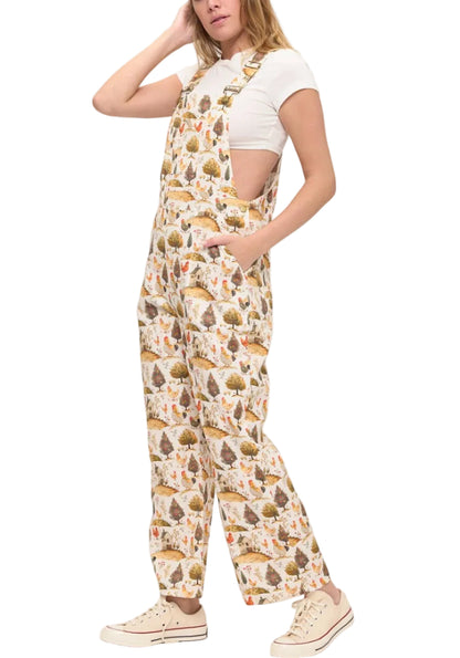 Woman wearing a patterned jumpsuit on a white background