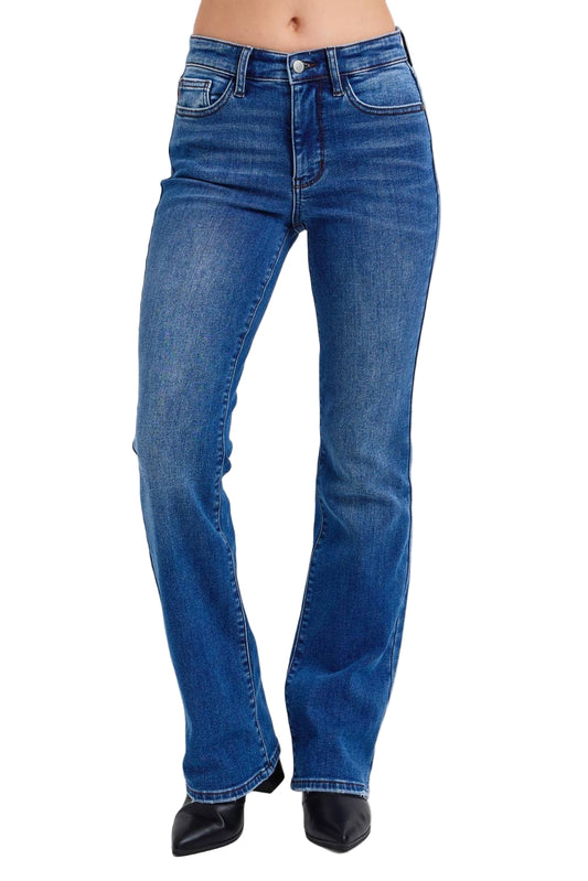 Blue jeans worn by a person on a white background
