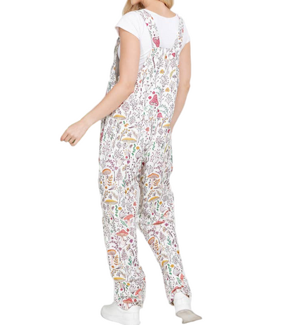 Woman wearing a floral patterned jumpsuit on a white background