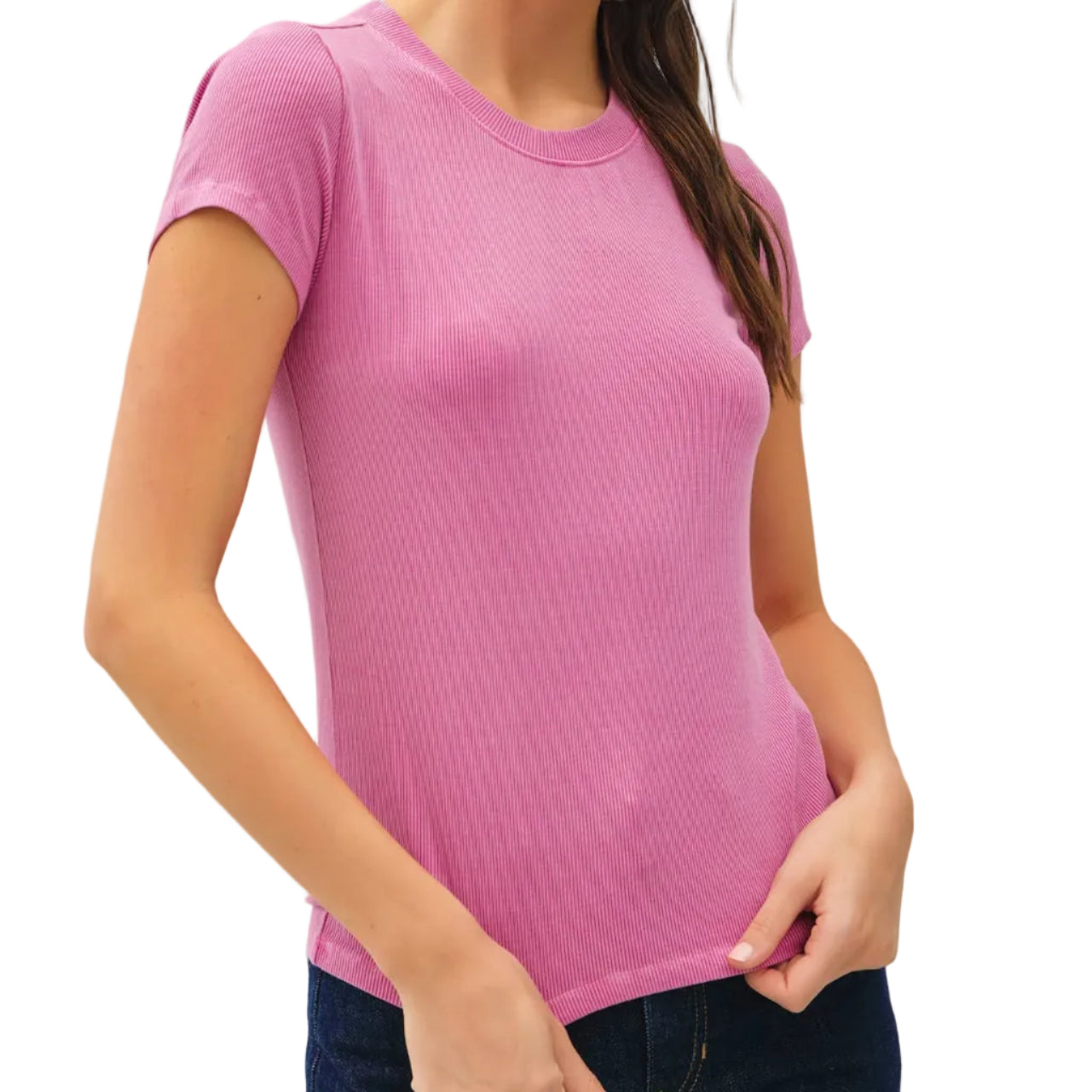 Woman wearing a pink t-shirt against a plain background