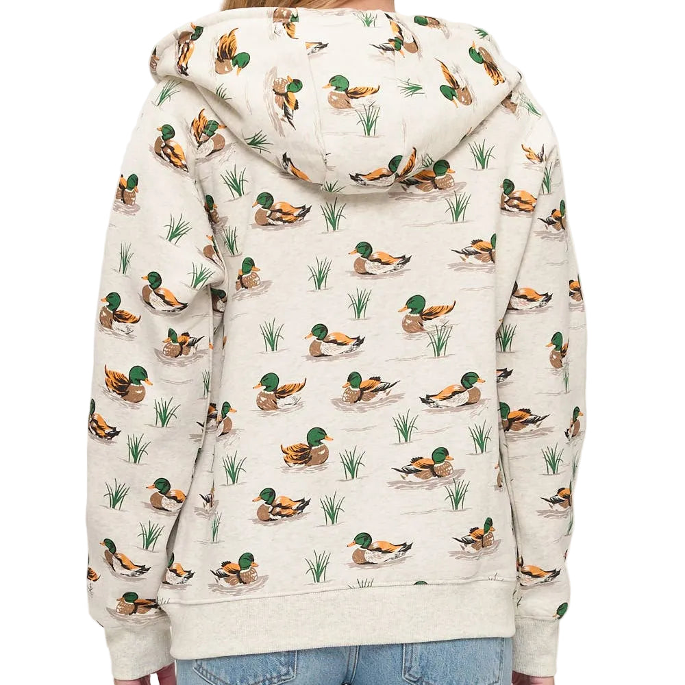 Person wearing a hoodie with duck pattern on a plain background
