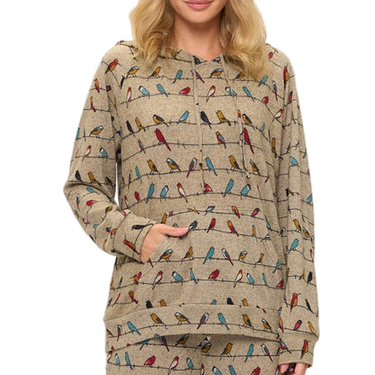 Woman wearing a patterned pajama set on a white background