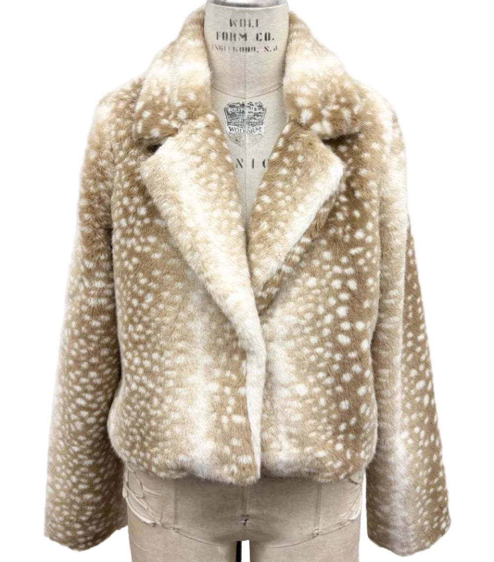 A beige faux fur jacket with white spotted pattern, displayed on a beige mannequin torso against a white background.