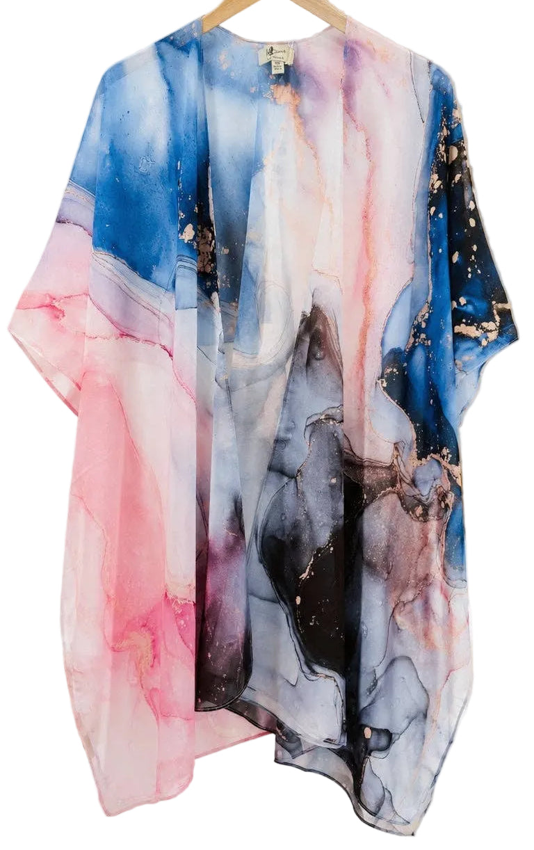Colorful abstract-patterned kimono hanging on a wooden hanger against a neutral background.