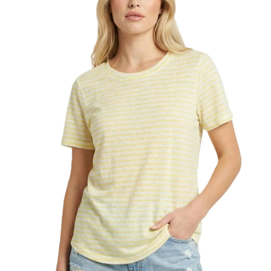 Woman wearing a yellow striped t-shirt and denim shorts on a white background