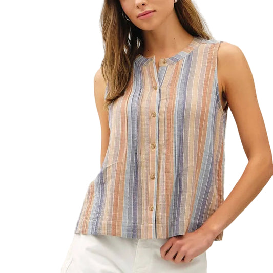 Woman wearing a striped sleeveless top and white shorts on a white background