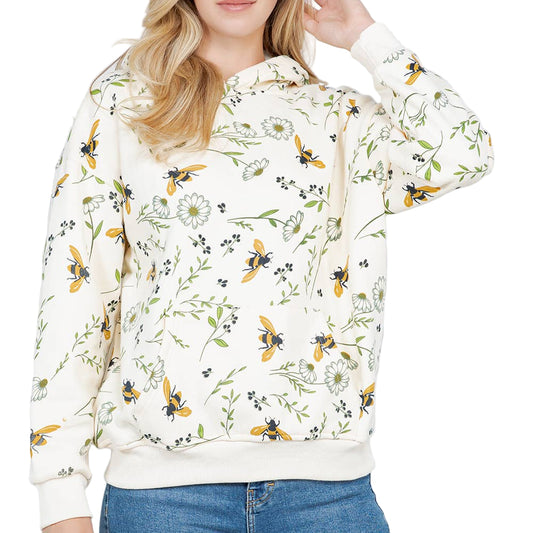 Woman wearing a floral hoodie with bee pattern on a white background