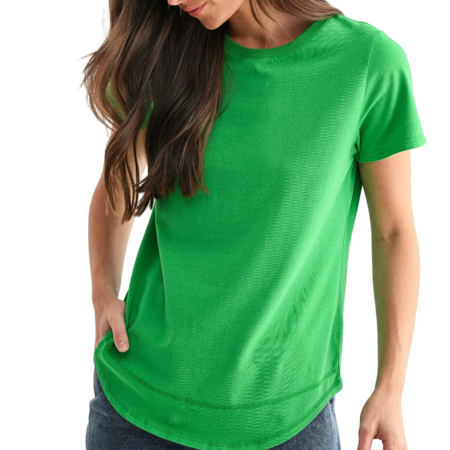 Woman wearing a green t-shirt and blue jeans on a white background