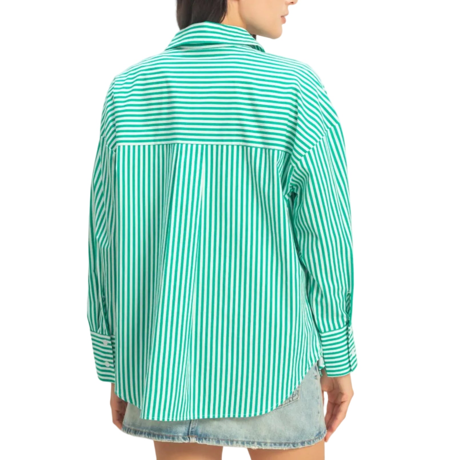 Woman wearing a green and white striped shirt against a plain background