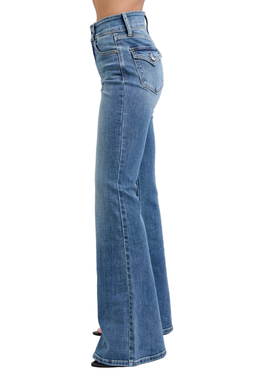 Blue jeans being worn on a white background