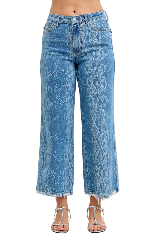 Blue acid-wash jeans worn by a person on a white background