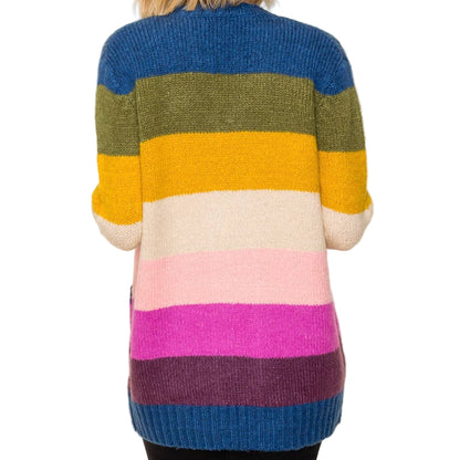 Multicolored striped sweater worn by a person on a white background