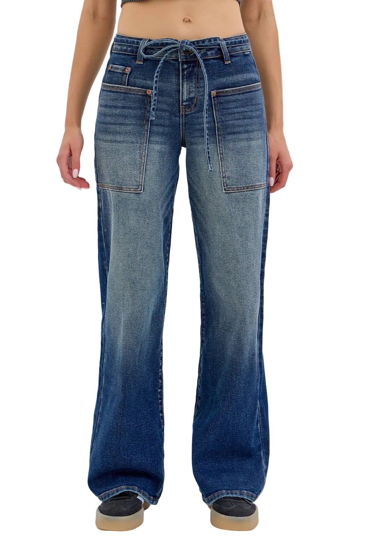 Blue jeans worn by a person on a white background