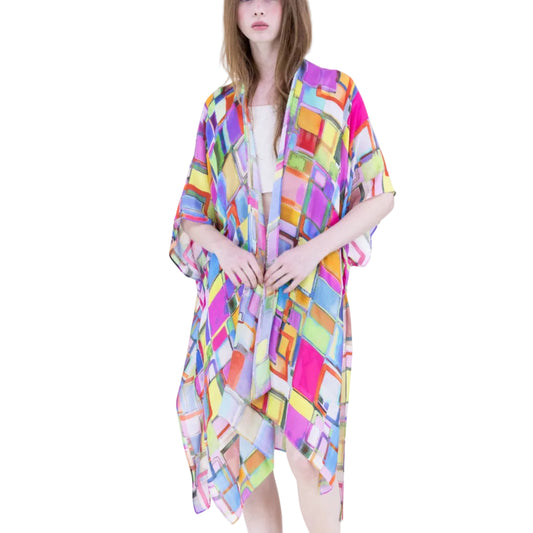 Woman wearing a colorful patterned kimono-style garment on a white background