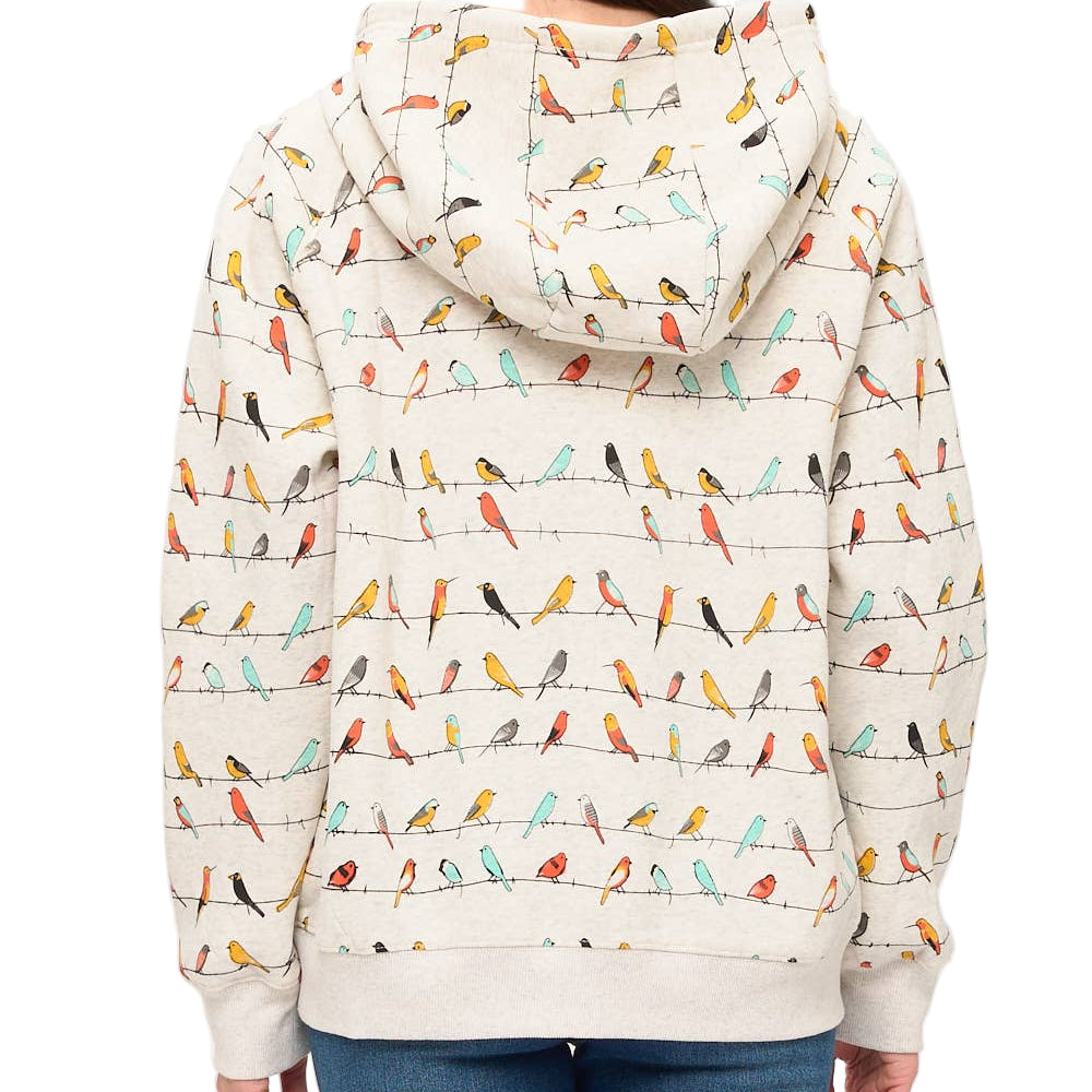 Person wearing a hoodie with colorful bird pattern on a white background
