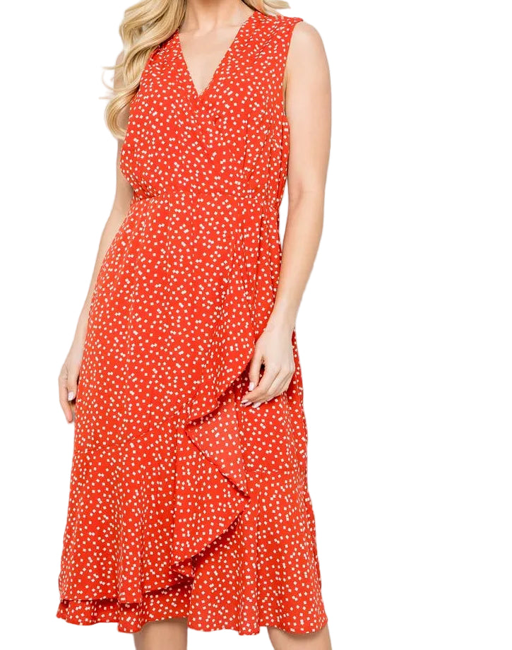 Woman wearing a red polka dot dress against a white background