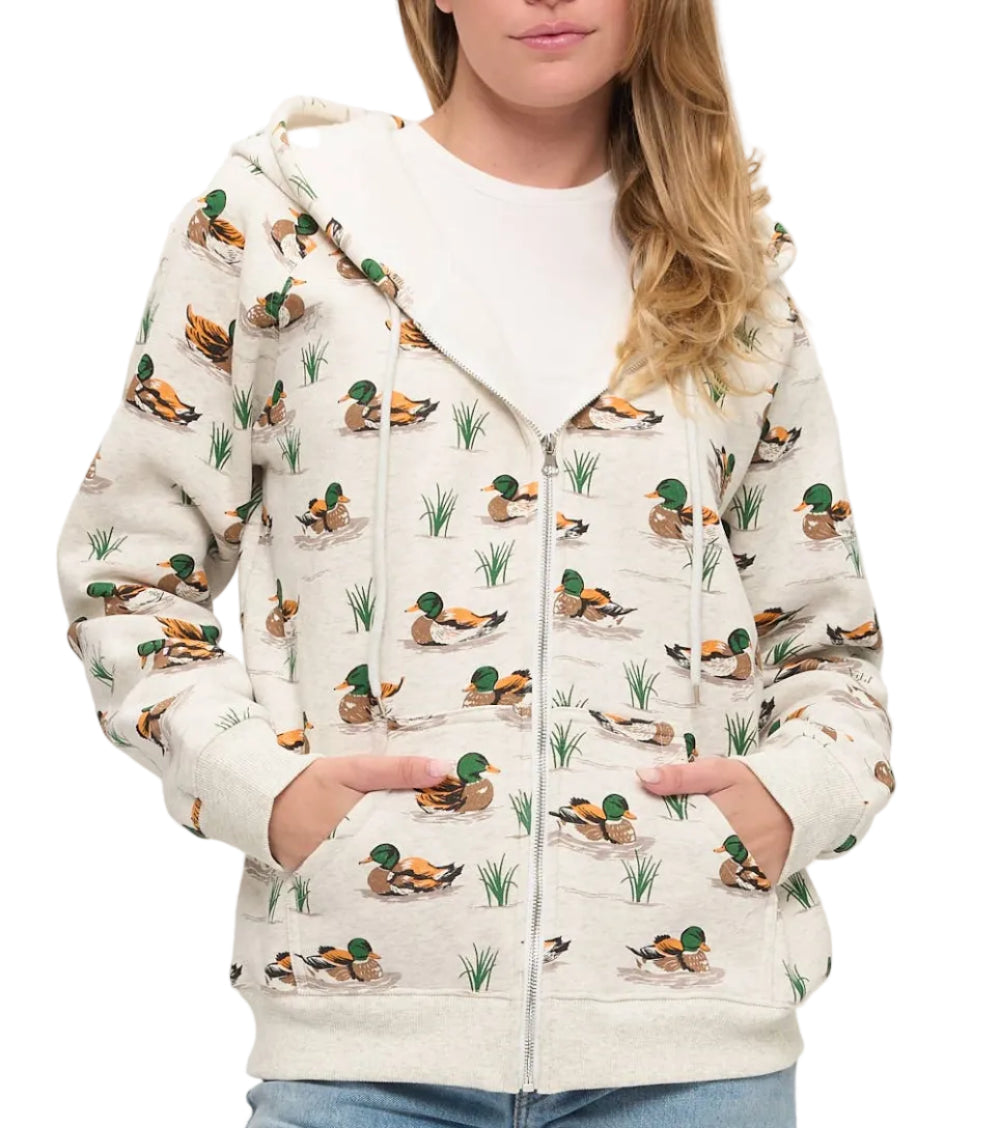 Woman wearing a hoodie with duck pattern on a white background