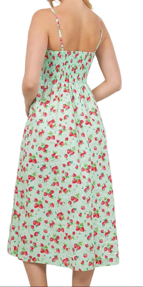 Woman wearing a floral dress in a room with plants