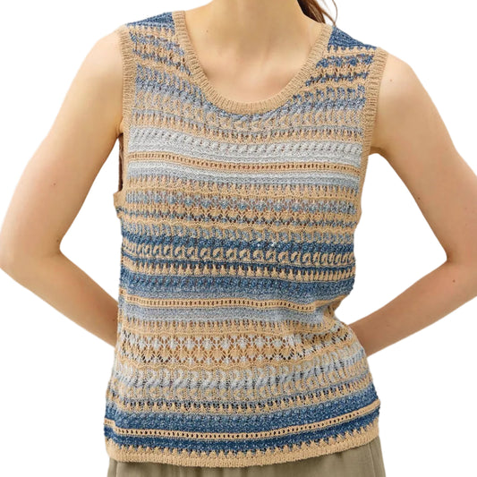 Woman wearing a sleeveless, multicolored knit top against a plain background