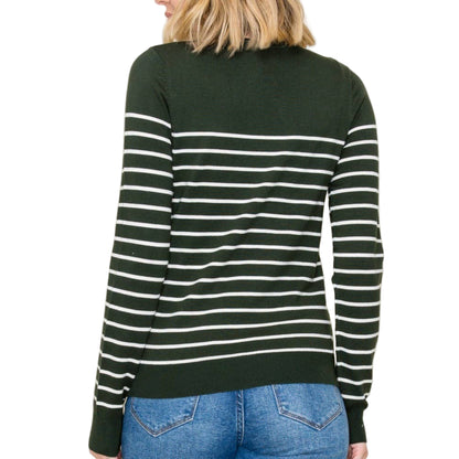 Person wearing a green and white striped sweater against a plain background