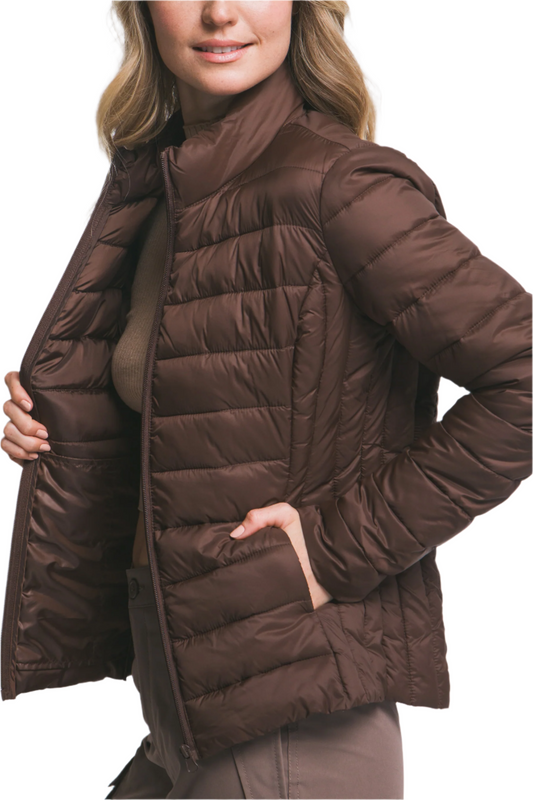 Brown puffer jacket worn by a person on a light gray background