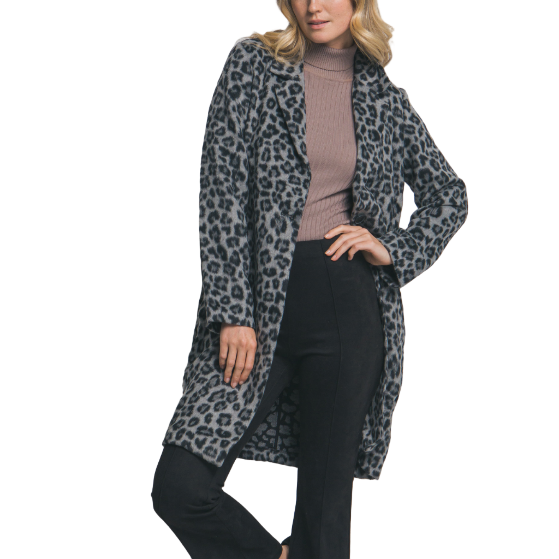 Woman wearing a leopard print coat over a pink top and black pants on a plain background