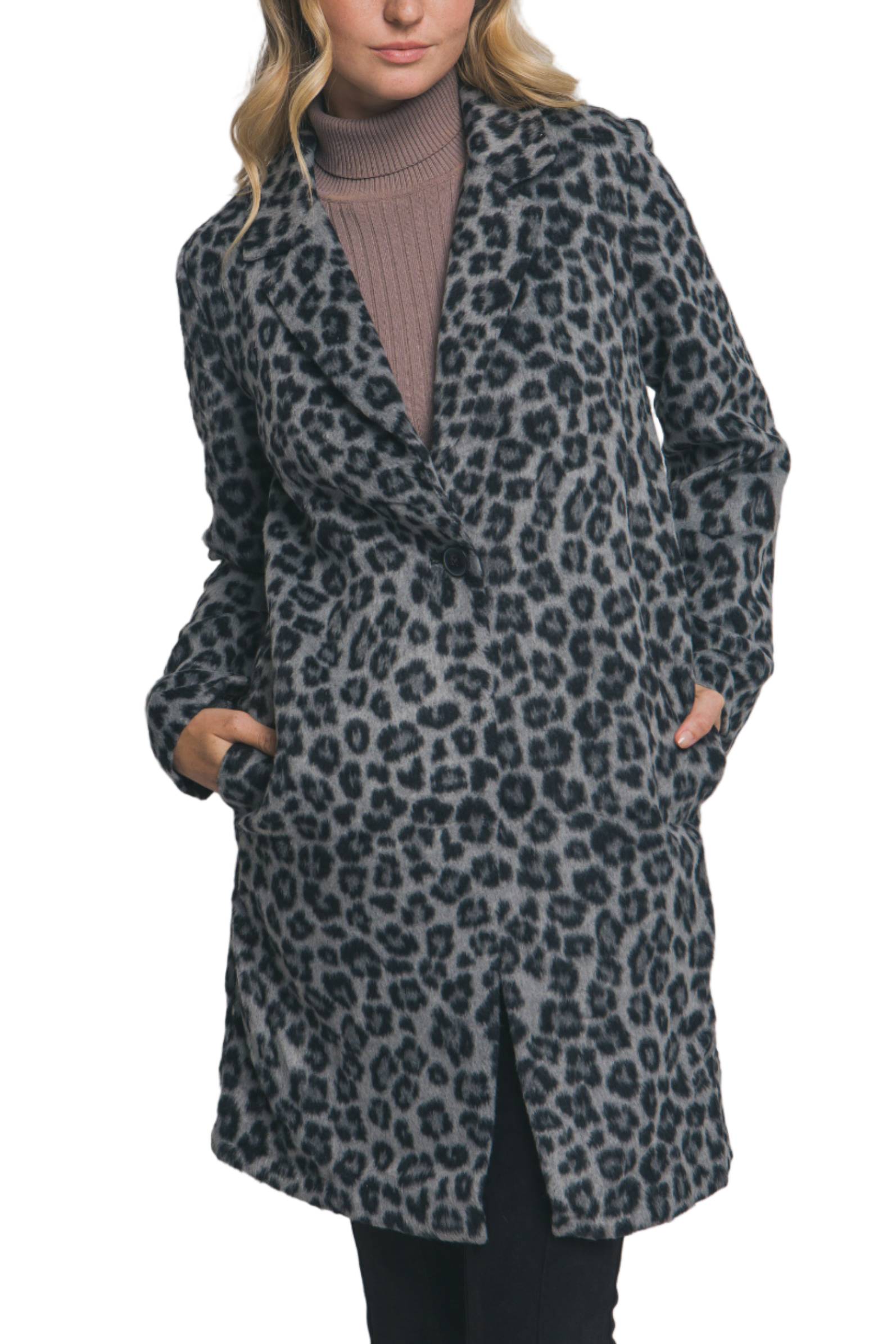 Woman wearing a leopard print coat against a plain background