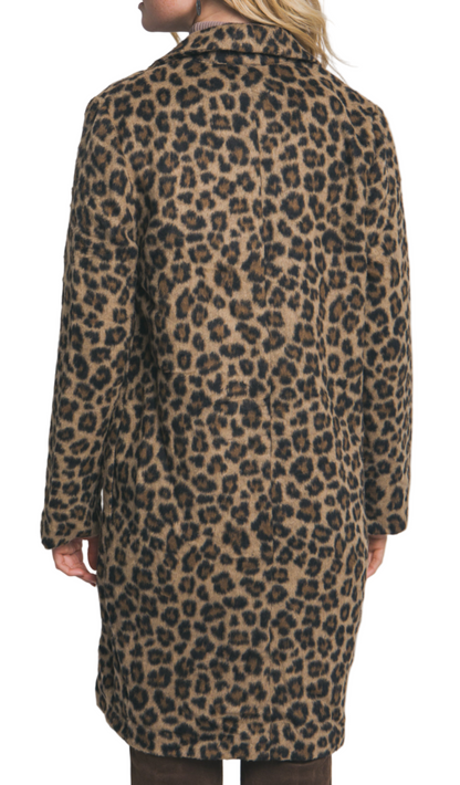 Leopard print coat worn by a person on a plain background