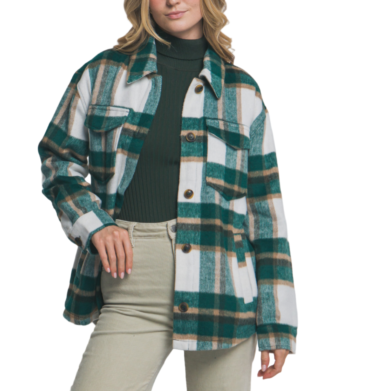 Woman wearing a plaid shirt over a black top with beige pants on a plain background