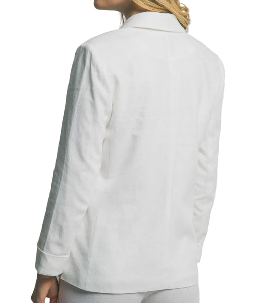 Woman wearing a white blazer with gray trim on a plain background