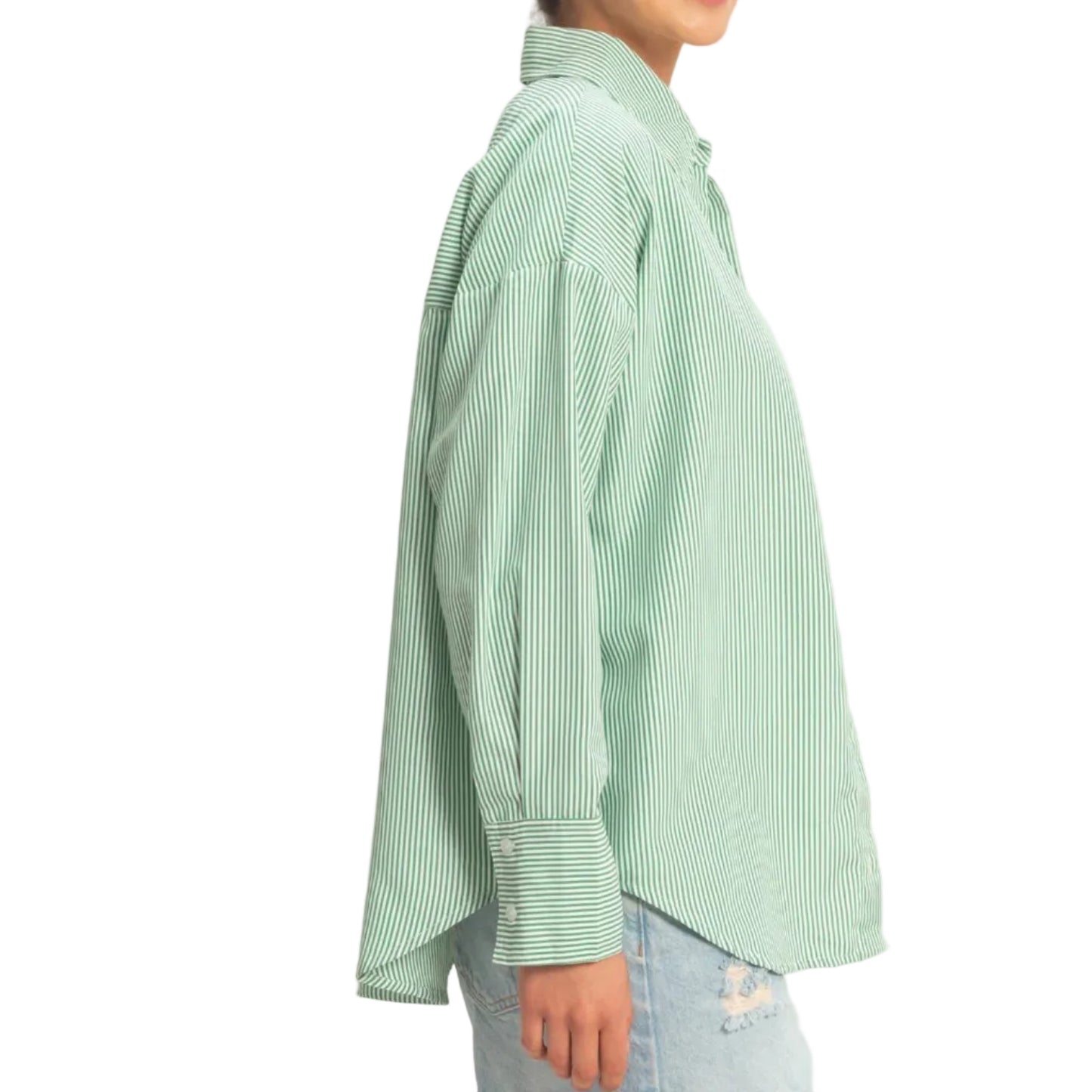 Person wearing a light green checkered shirt and denim shorts on a plain background