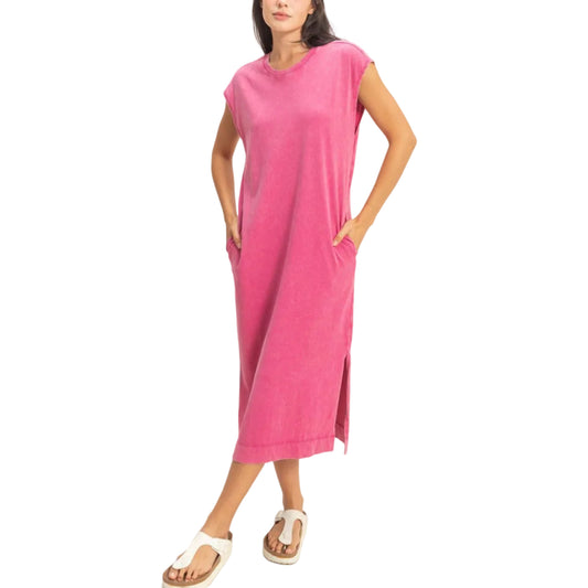 Woman wearing a pink dress against a white background