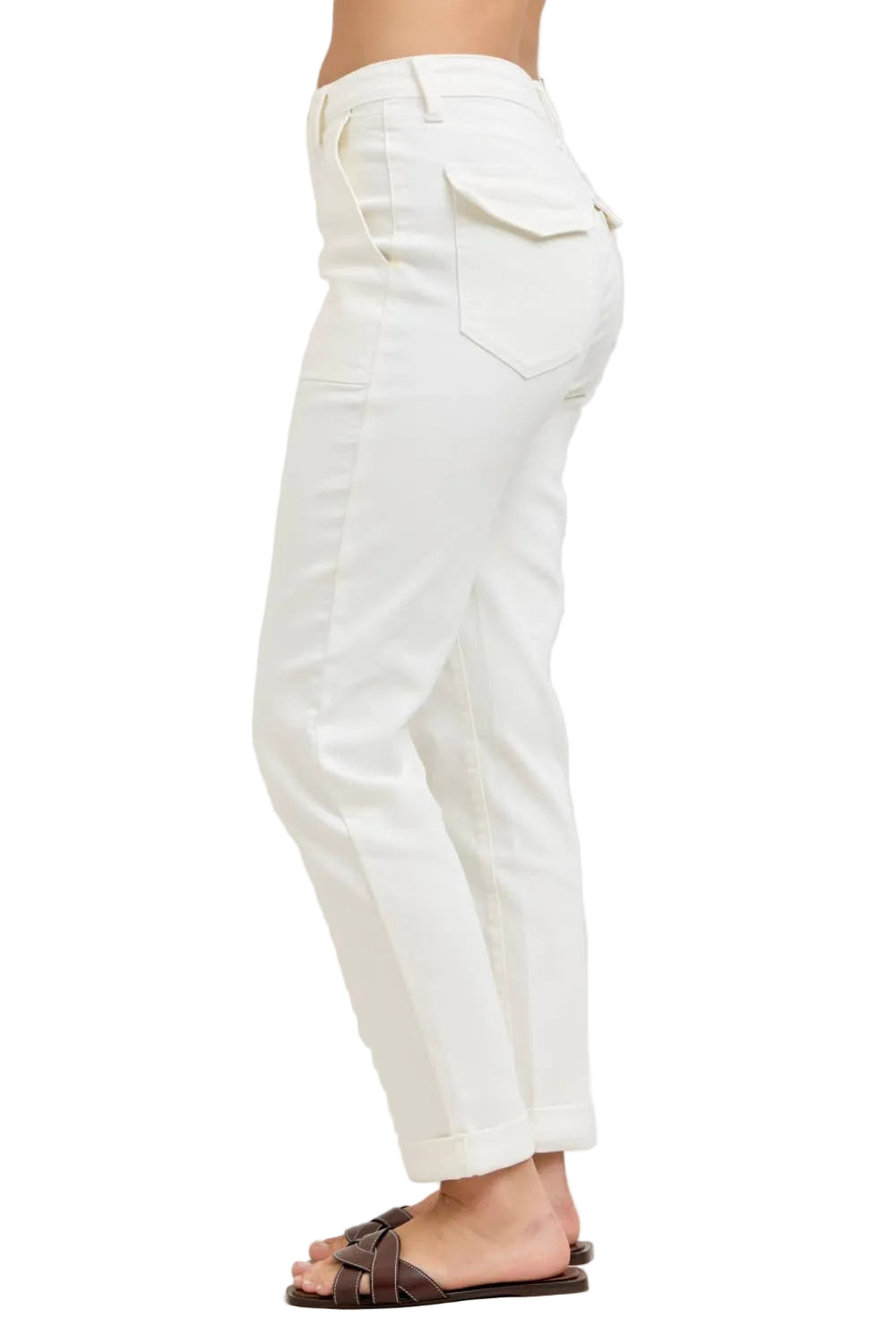 White pants worn by a person on a plain background