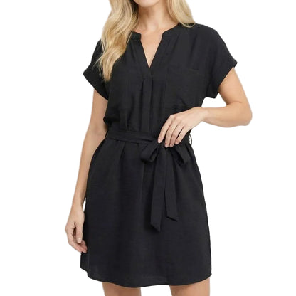 Woman wearing a black dress on a white background