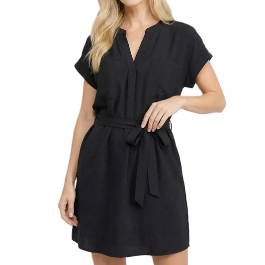 Woman wearing a black dress on a white background