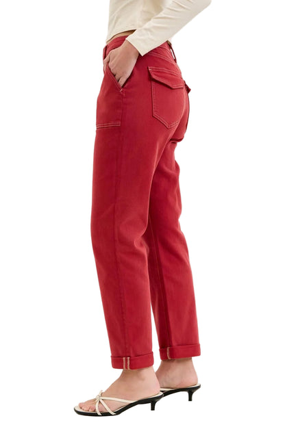 Red pants worn by a person on a white background
