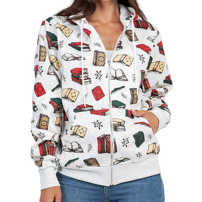 Woman wearing a white hoodie with book-themed design on a plain background