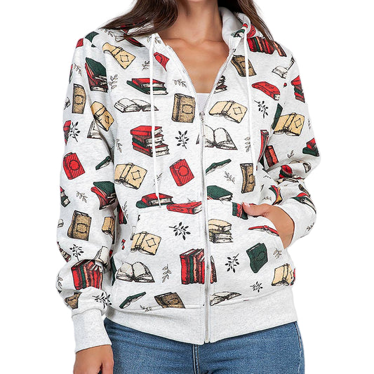 Woman wearing a white hoodie with book-themed design on a plain background