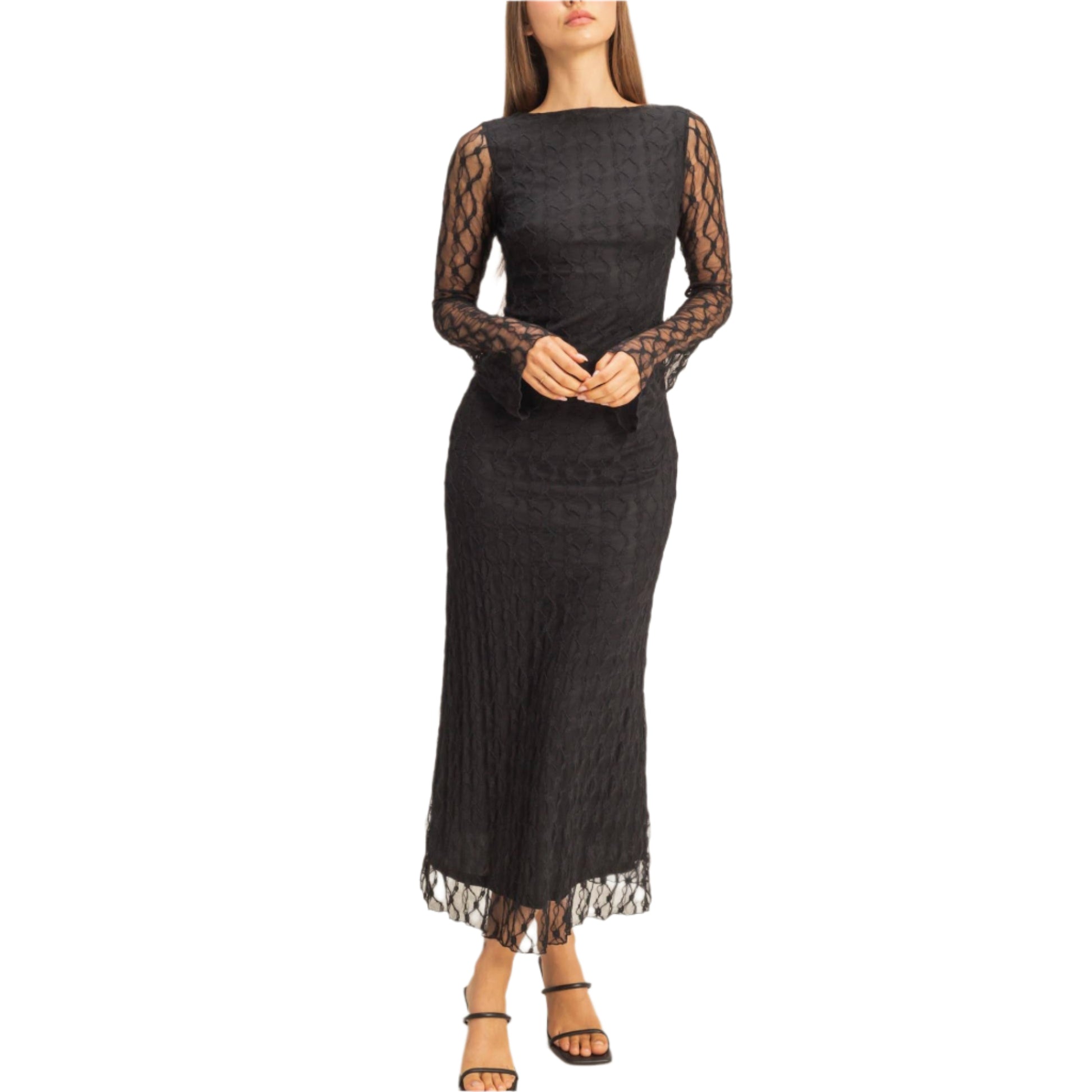 Woman wearing a black lace dress on a beige background