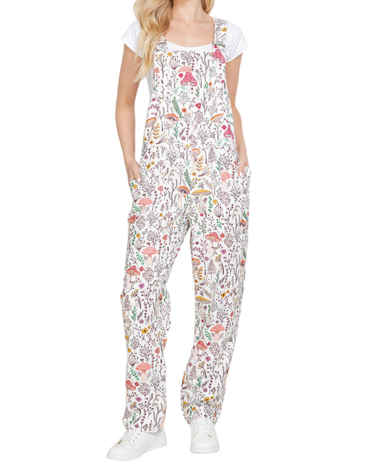 Woman wearing a colorful patterned jumpsuit on a white background