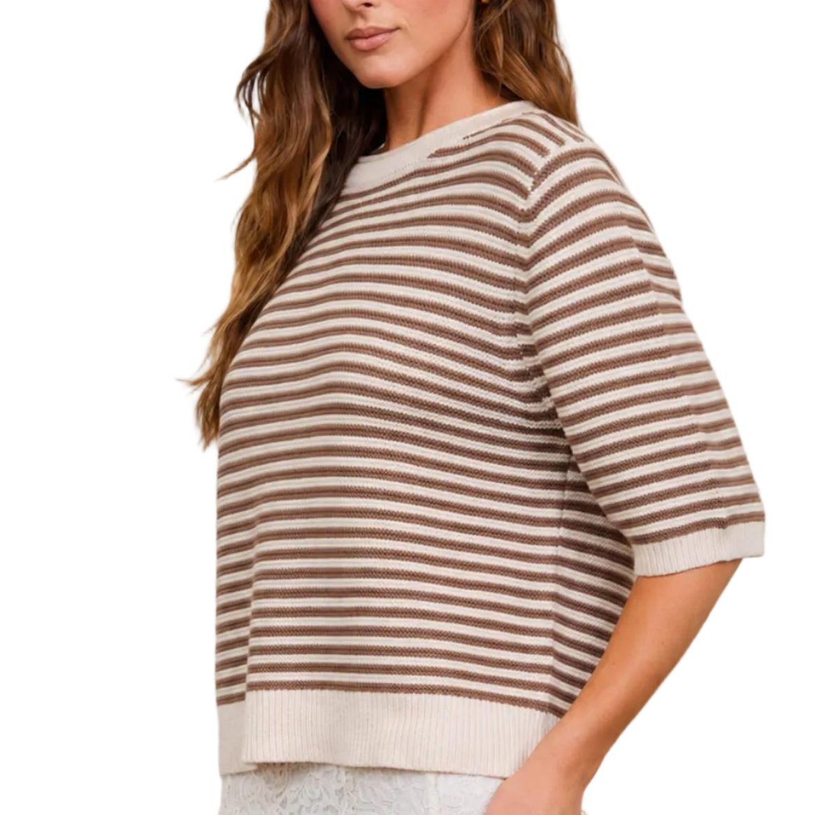 Woman wearing a striped shirt in front of a neutral background