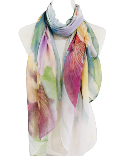 Colorful scarf with floral pattern on a mannequin against a neutral background