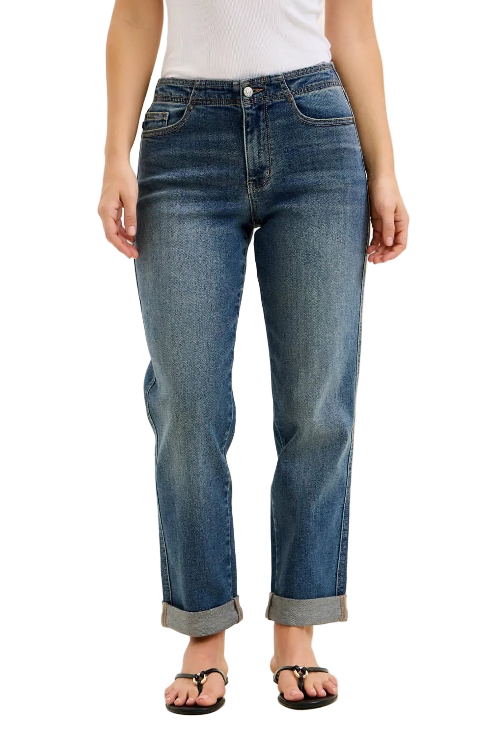 Person wearing blue jeans on a beige background