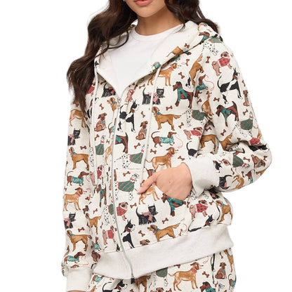 Woman wearing a hoodie with dog pattern on a plain background