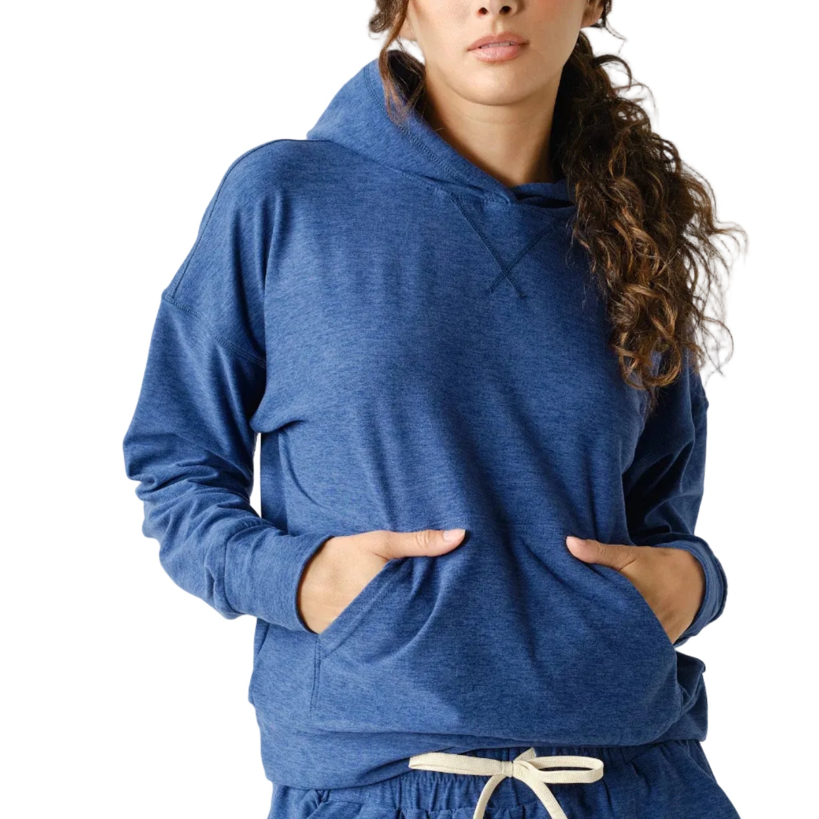 Woman wearing a blue hoodie and shorts set on a white background