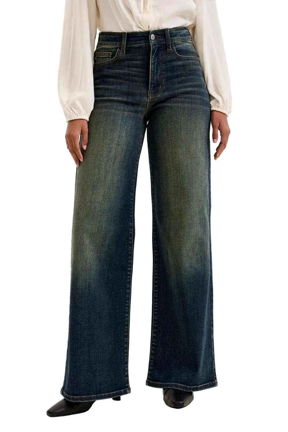 Person wearing dark blue wide-leg jeans on a plain background