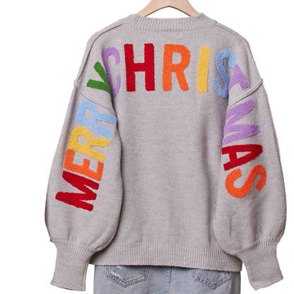 Gray sweater with colorful text on a hanger against a neutral background