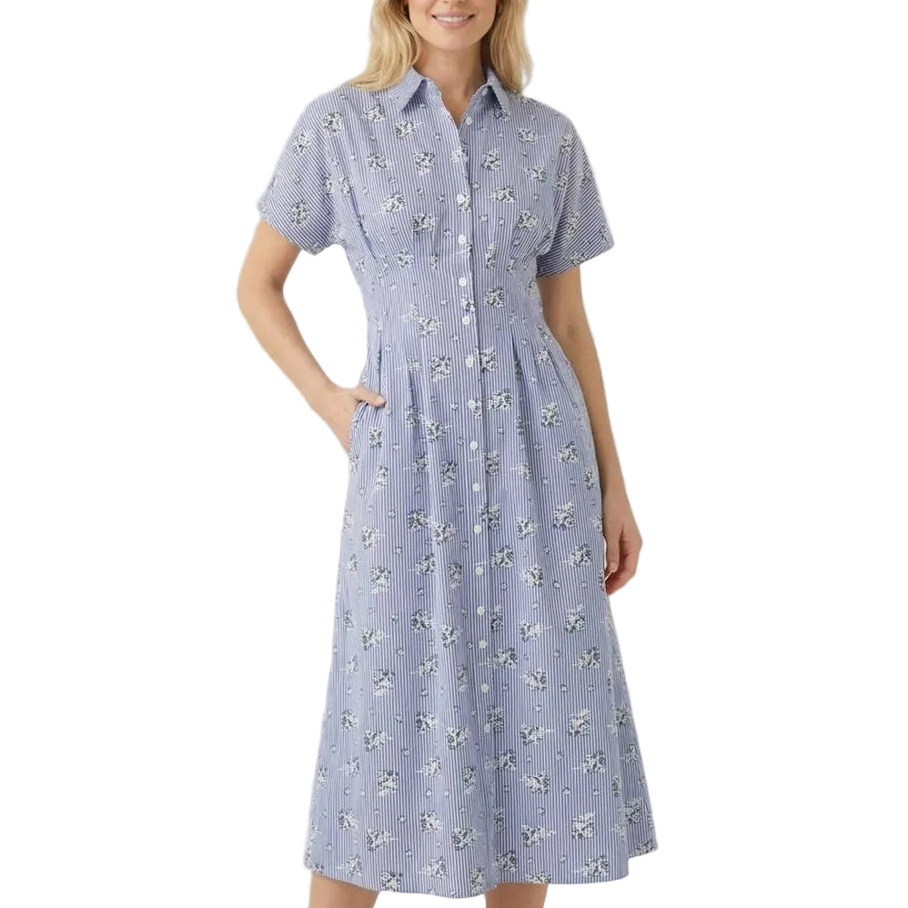 Woman wearing a blue floral dress on a white background